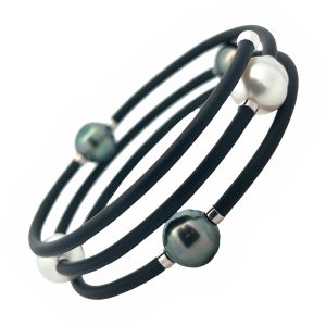 Flexible triple bracelet with 3 Tahitian, 2 South Sea & 2 white cultured pearls.