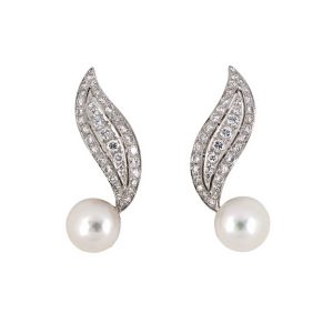Graceful platinum vintage swirl leaf drop earrings with 72 diamonds & 2 – 10.8mm button pearls.