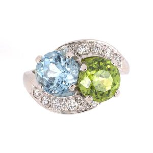 Vintage platinum peridot, aquamarine & diamond bypass ring.