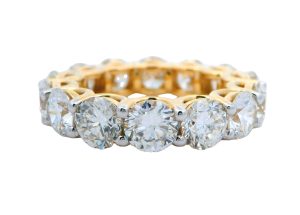 14 Karat yellow gold eternity ring set with 14 round brilliant lab-grown diamonds totaling 8.27 carats.