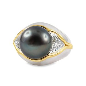 18 Karat white & yellow gold vintage ring set with a 11.5 mm black South Sea pearl & 2 trilliant diamonds totaling about 1 carat.