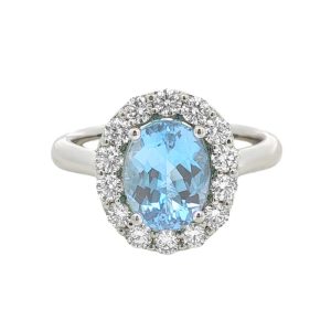 18 Karat white gold halo ring set with a 1.75 carat oval aquamarine and 14 diamonds totaling .63 carats. 