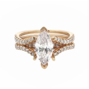 14 Karat yellow gold engagement style split-shank ring mounting set with 36 diamonds totaling .35 carat and a marquise CZ center.